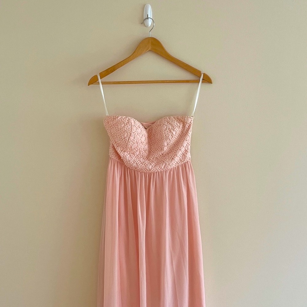 Pink strapless formal dress.